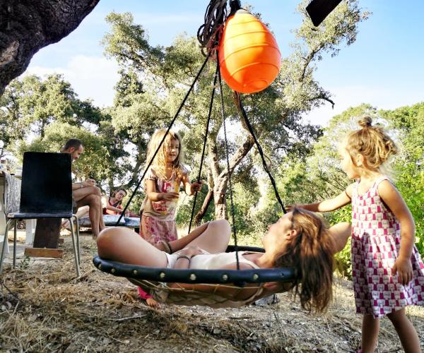 Children's swing under the oak